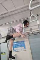 A schoolgirl climbed on top of the train net rack