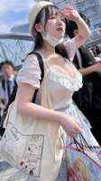 A huge breasted otaku is photographed at Comiket