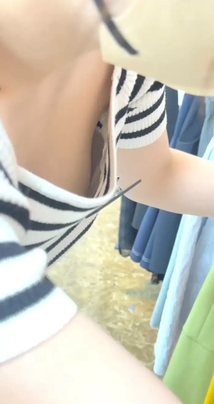 98 amateur cleavage erotic images: A collection of hidden camera footage of ordinary women whose cleavage is too visible 39th image